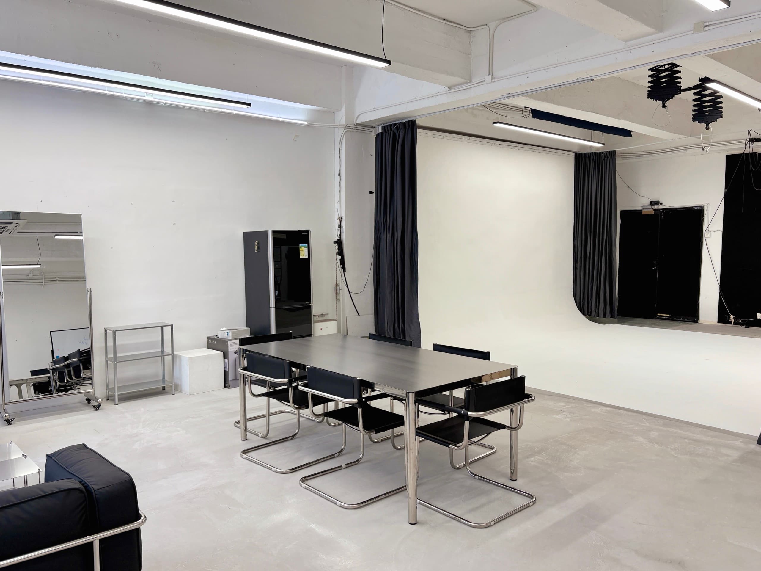The OpenStudio floor — worktable in the foreground, the cyclorama beyond